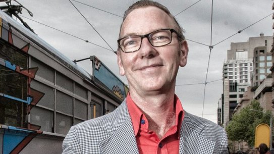 Artist Jon Campbell, seen in 2013 with one of his designs for an art tram.