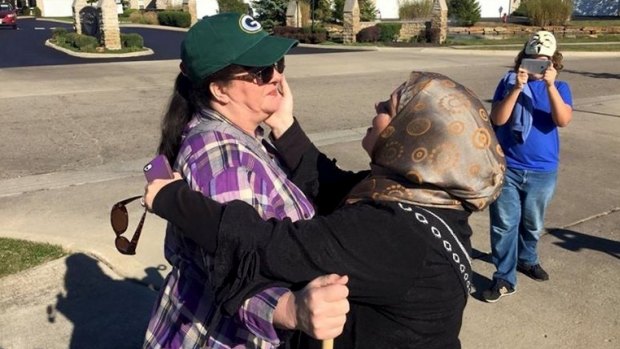 Cynthia DeBoutinkhar embraces an anti-Islam protester outside the Noor Islamic Cultural Center in Columbus, Ohio.