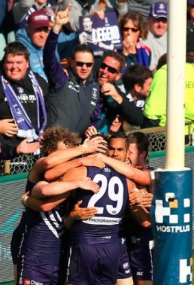 Fremantle players and fans celebrate as Matthew Pavlich boots his 700th goal