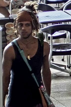 Police are currently searching for this man who allegedly produced a knife at a Gold Coast film set.