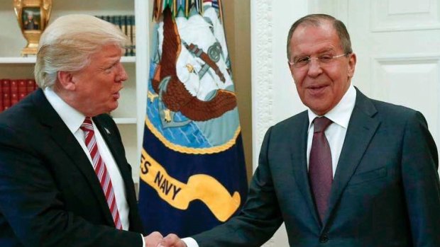 US President Donald Trump shakes hands with Russian Foreign Minister Sergey Lavrov in the White House in Washington.