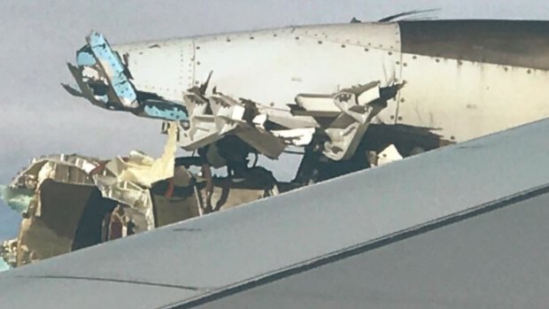 A photo of the damaged engine on Air France flight 66, which was en route to Los Angeles when pilots were forced to make an emergency landing in Canada. Photo was taken by passenger Rick Engebretsen