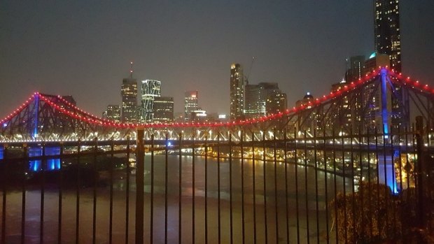 The Story Bridge lit blue, white and red in solidarity with the victims of the Paris terror attacks.