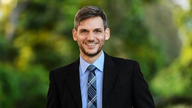 The Greens have named environmental lawyer Michael Berkman to run against state Environment Minister Steven Miles in their 'most winnable' seat.