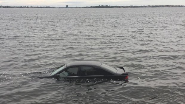 The car in the Swan River after the incident.
