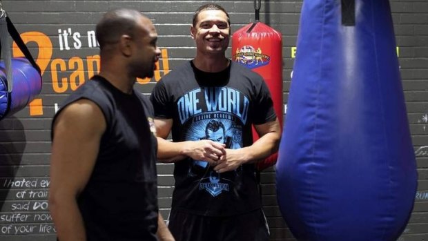 Motivating: Timana Tahu watches as boxing legend Roy Jones Jr leads a boxing class at One World Boxing Academy.