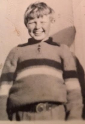 Wayne Bond as a child wearing a hand-knitted Footscray jumper.