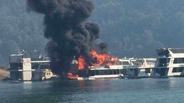 Flames engulf the house boat.