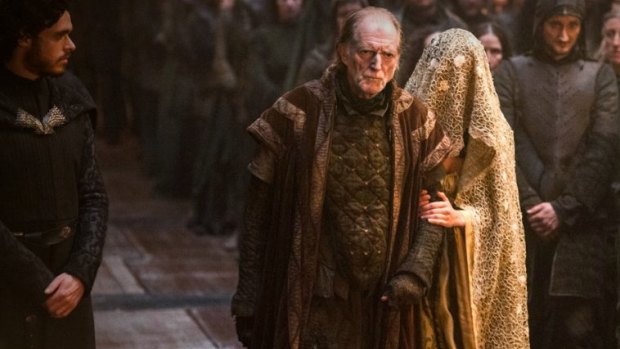 Robb Stark (left) attends the Red Wedding held by Lord Walder Frey (centre).