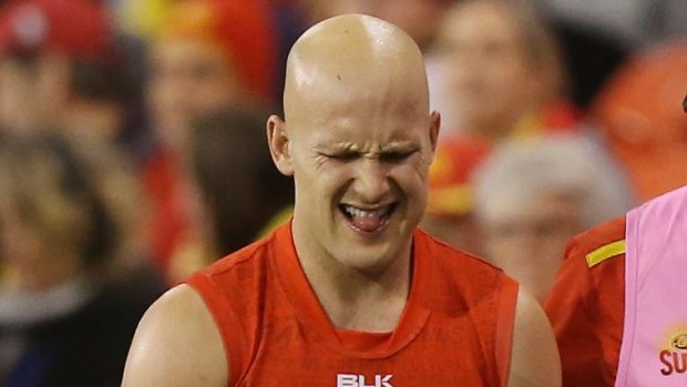 Gold Coast's Gary Ablett leaves the ground in round 16 after injuring his shoulder.