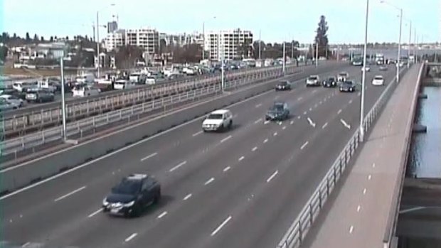 A shattered sheet of glass has closed two lanes of the Kwinana Freeway southbound near the Narrows Bridge