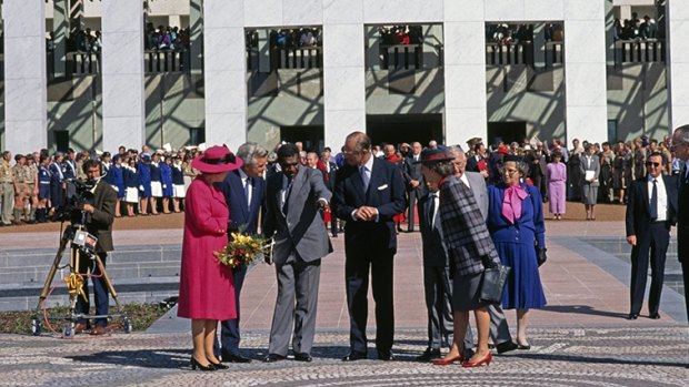 Queen Elizabeth II, Prime Minister Bob Hawke, artist Michael Nelson Jagamara and the Duke of Edinburgh at the official opening of new Parliament House, Canberra, 1988.