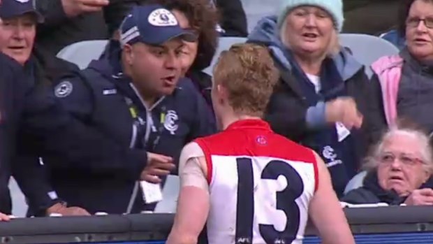 Clayton Oliver argues with a Carlton fan in the match at the MCG on Sunday. 
