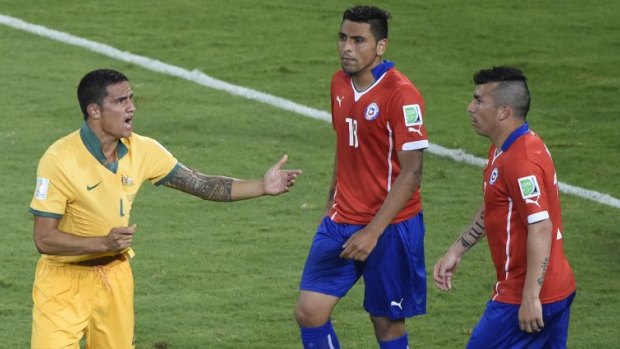 Tim Cahill appeals towards the referee.