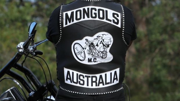 A former Mongols bikie is accused of assaulting harness racing drivers.