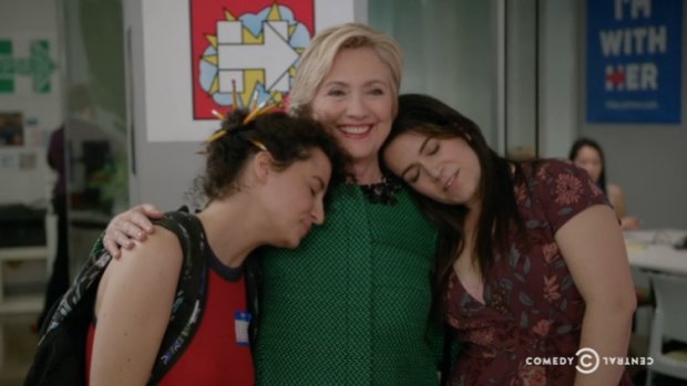 Hillary Clinton embraces Abbi Jacobson and Illana Glaser on Broad City.