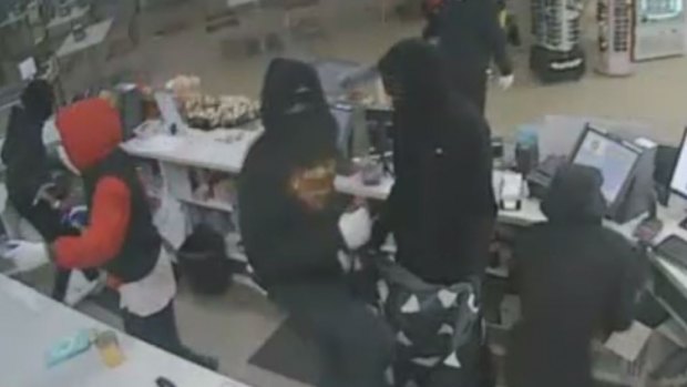 A group of up to seven armed men are believed to have been behind service station robberies in Hillside, Laverton North and Rockbank. 