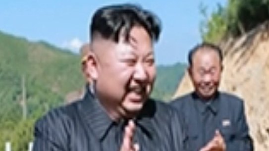 North Korea leader Kim Jong Un, centre, applauds after the launch of an intercontinental ballistic missile last month.