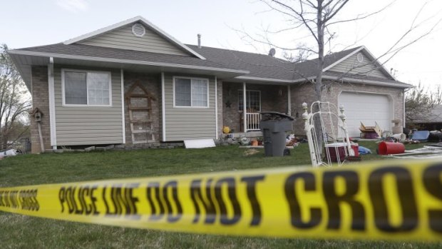 Police tape cordons off the house in which the bodies of seven babies were discovered in Pleasant Grove, Utah.