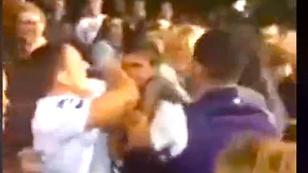 A mobile phone camera caught the moment a Fremantle fan shoved a woman, and the brawl that followed.