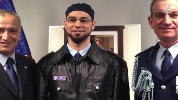 Sheikh Ahmed Abdo is seen in the video with community leader Jamal Rifi and Police Commissioner Andrew Scipione on the day he was appointed a NSW Police Force chaplain.