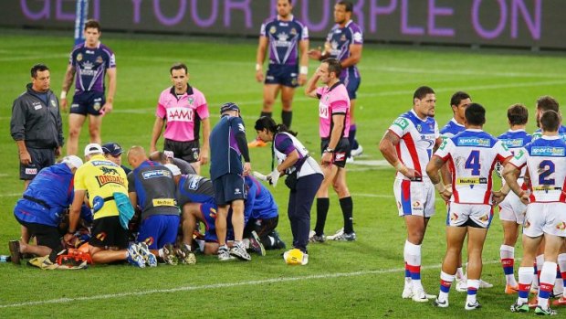 Tragic accident: Knights players in a huddle after Alex McKinnon's devastating injury.