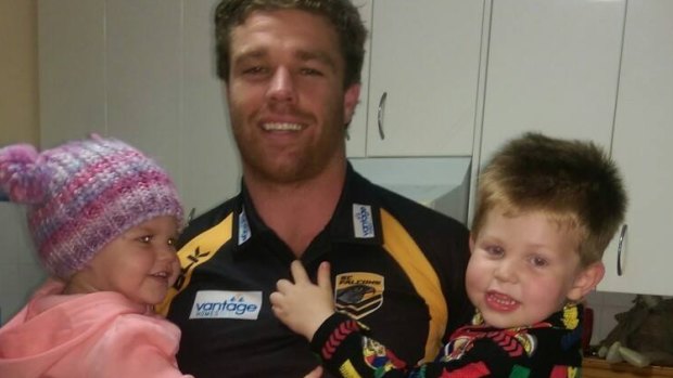 James Ackerman, 25, pictured here with children Olliver and Milly, died after being injured in a tackle in Queensland in June.