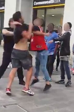 A video still from the brawl which was filmed in Murray Street Mall on Thursday.