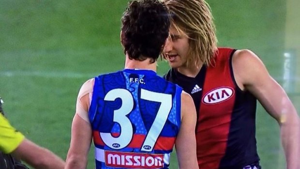 Bob Murphy with Essendon's stand-in skipper Dyson Heppell at the coin toss.