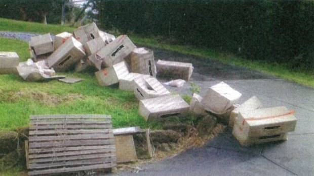 Boxes of rolls dumped outside the property in Templestowe