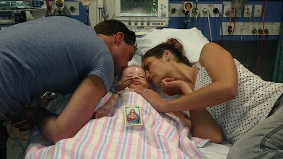 Grant and Naomi Day with Kyran at Sydney Children's Hospital. 