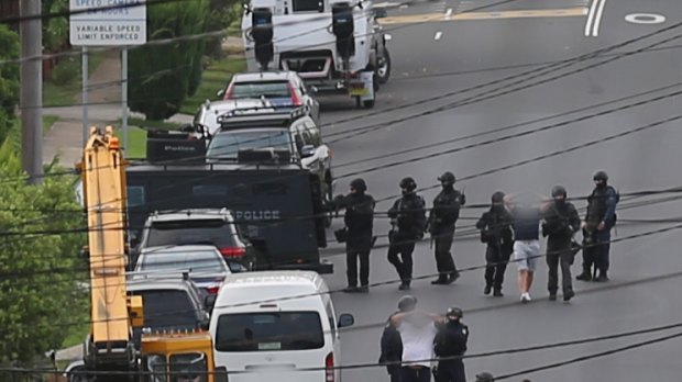 A man is arrested over a plot to shoot Merrylands Police Station.