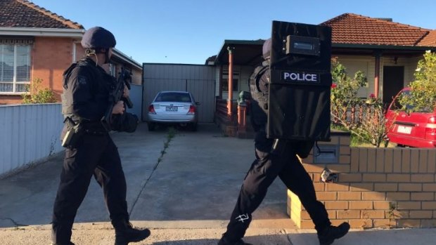 The sleeping suburb of St Albans was crawling with special operations police on Monday morning.