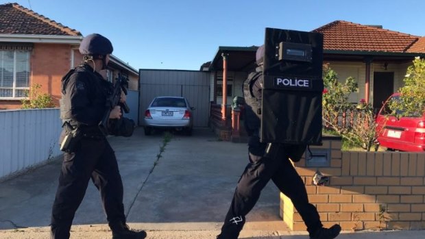 The sleeping suburb of St Albans was crawling with special operations police on Monday morning.