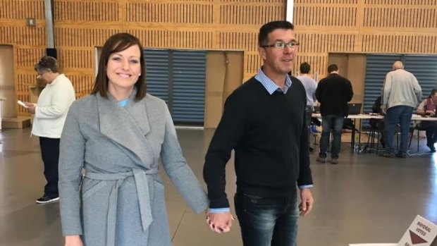 Strong contender Cr Andrew Antoniolli and wife Karina vote early on Saturday.