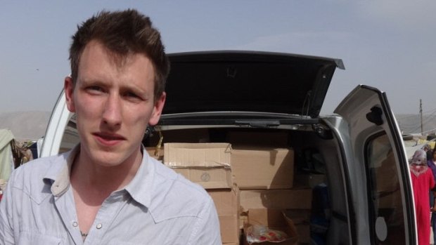 Peter Kassig delivering aid last year.