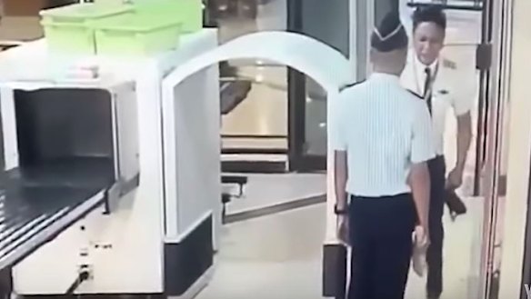A video captured a Citilink pilot staggering through security at Surabaya airport.