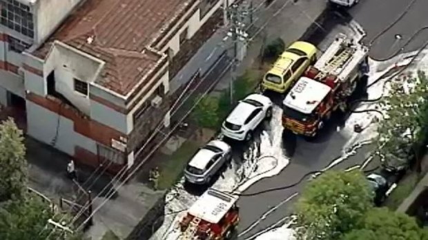 Firefighters outside the St Kilda apartment complex.