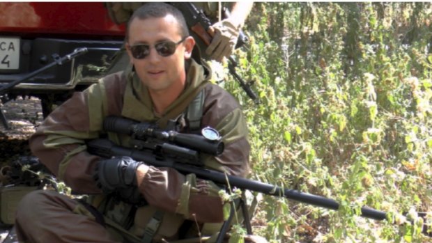 Modern weapon: A separatist cradles a Russian-made ASVK rifle.