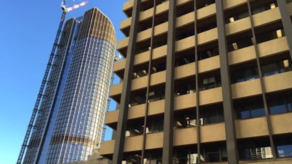 The old and the new of Queensland's public sector - 1 William Street (left) and the soon-to-be demolished Executive Building. Staff are set to move in from October 21. 