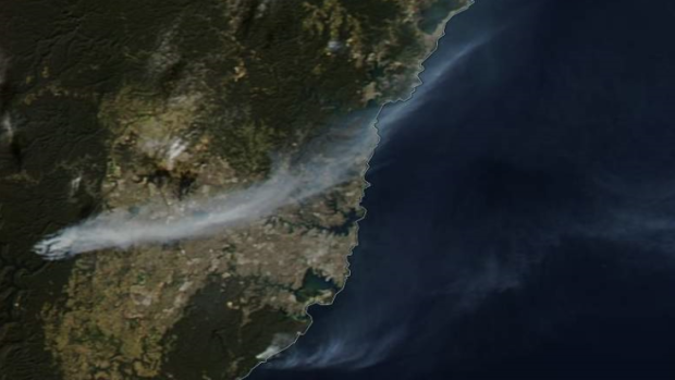 Satellite image shows the smoke from fires streaming across the Sydney Basin from fires near Warragamba Dam.