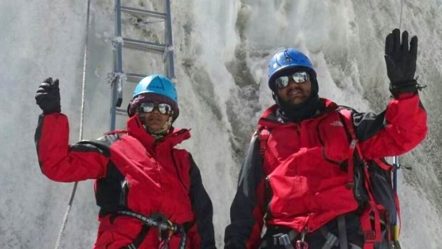 Dinesh and Tarakeshwari Rathod in their red gear on what they said was Mount Everest. 