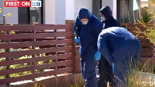 Forensic officers scouring the area in Champion Lakes on Thursday.