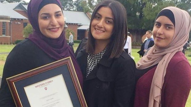 Amani, Nour and Ola with their mother's posthumous degree from Western Sydney University.
