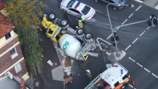 A cement truck that rolled over on Gregory Tce at Brunswick St in Spring Hill caused inner city delays.