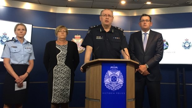 Chief Commissioner Graham Ashton with Premier Daniel Andrews, right, and Police Minister Lisa Neville, left.