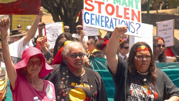Protesters campaign against the removal of Aboriginal children. 