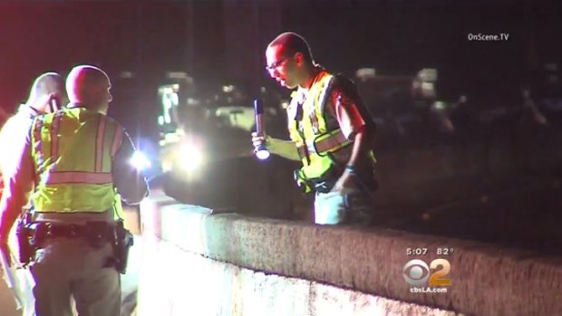 Police at the scene on the 101 Freeway.