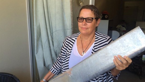Colleen Touhy with the 12-kilogram bollard that smashed into her home in Northbridge.