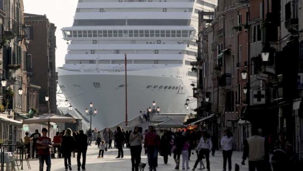 A cruise ship dwarfs Via Garibald as it arrives in Venice.